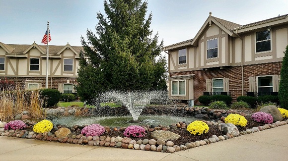 Office space for lease in Mequon at the Mequon Office Park showing front of building with fountain.